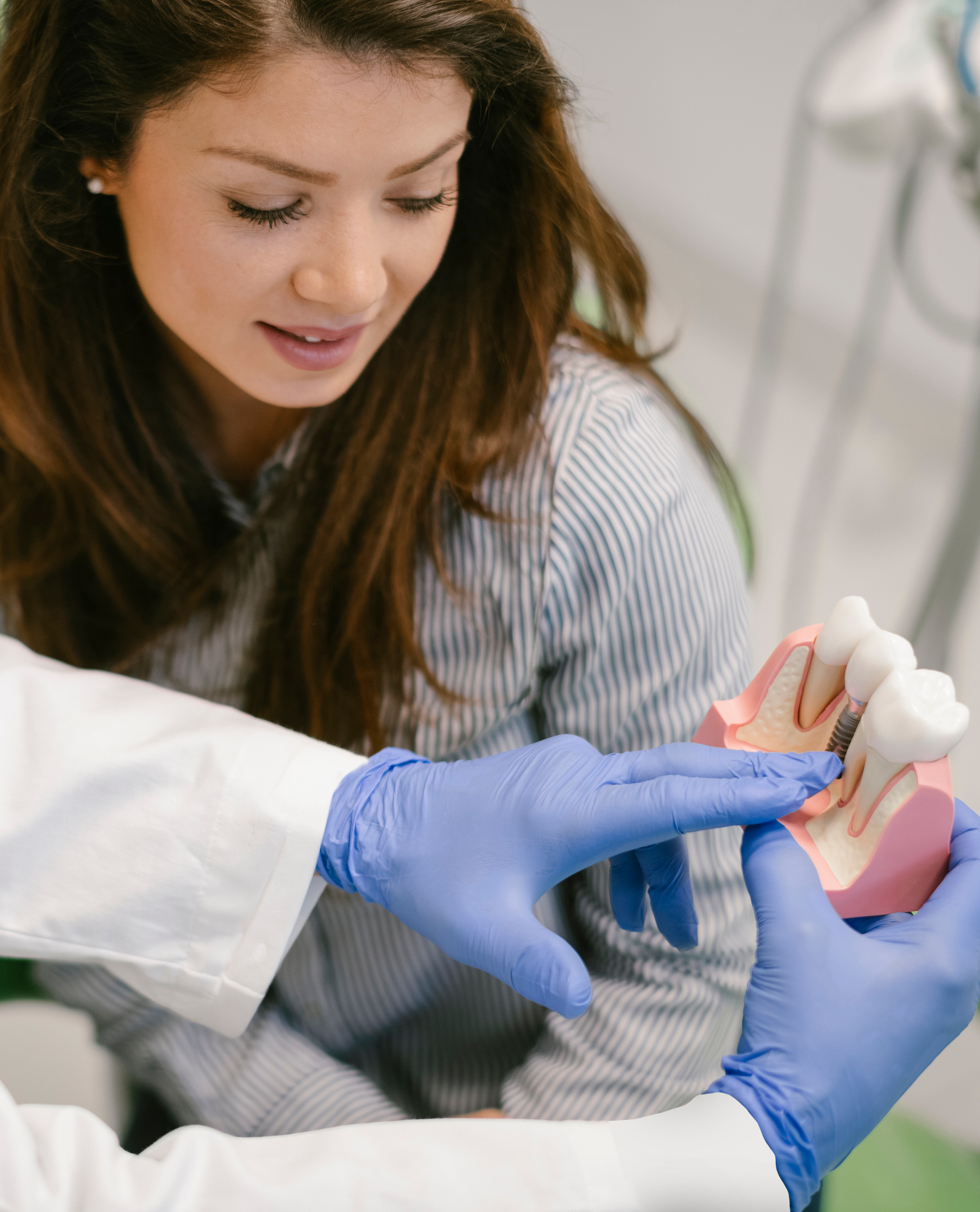 Dentist performing implantology procedure