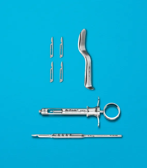 Hu-Friedy surgical scalpel blades, aspirator and syringe